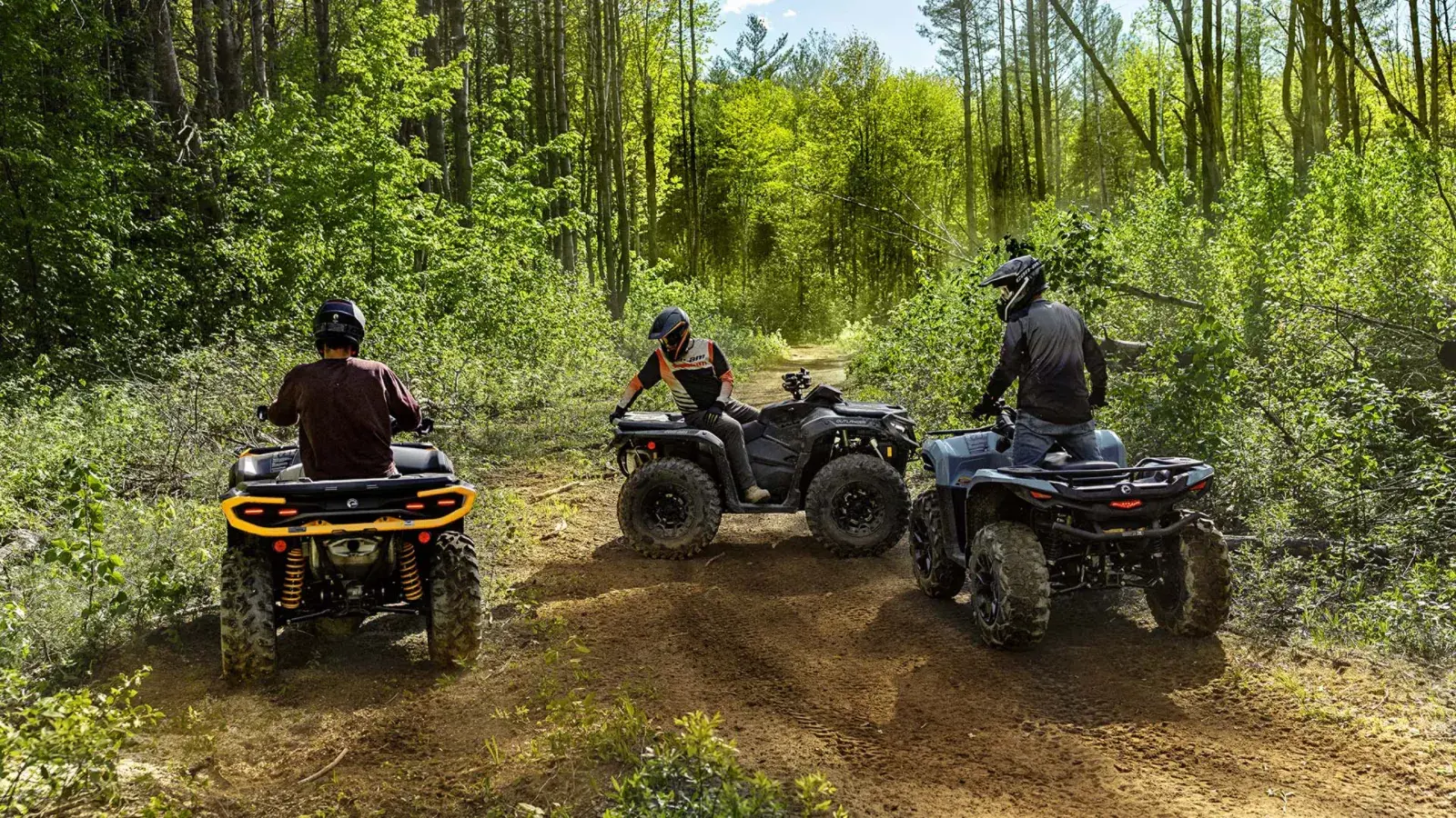Can-Am ATVs on a forest trail